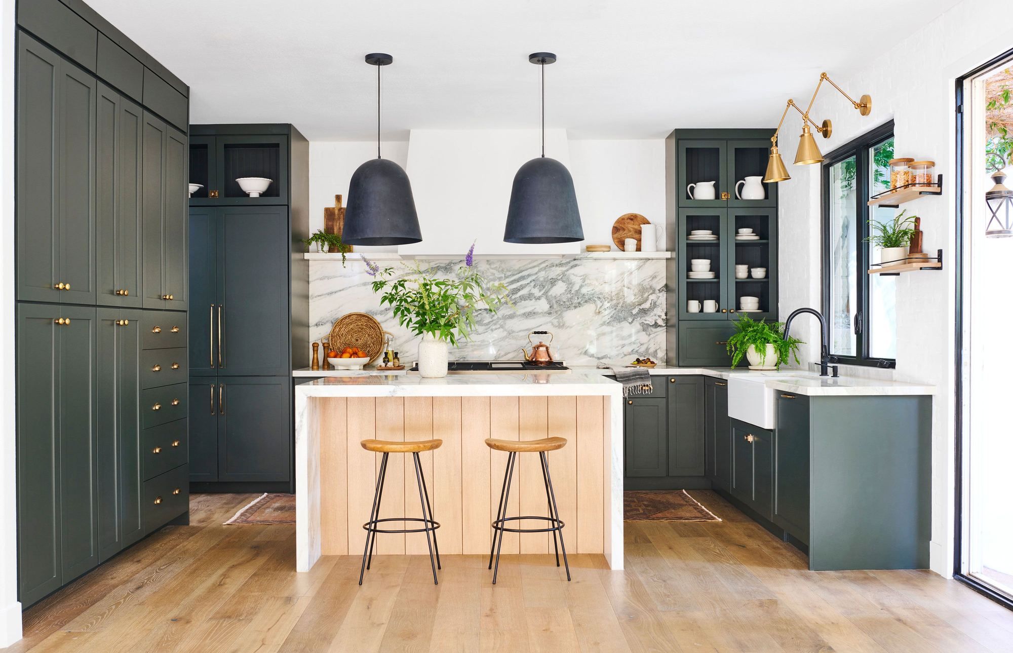 Kitchen remodeling in Raleigh NC with white cabinetry, quartz island and pendant lighting