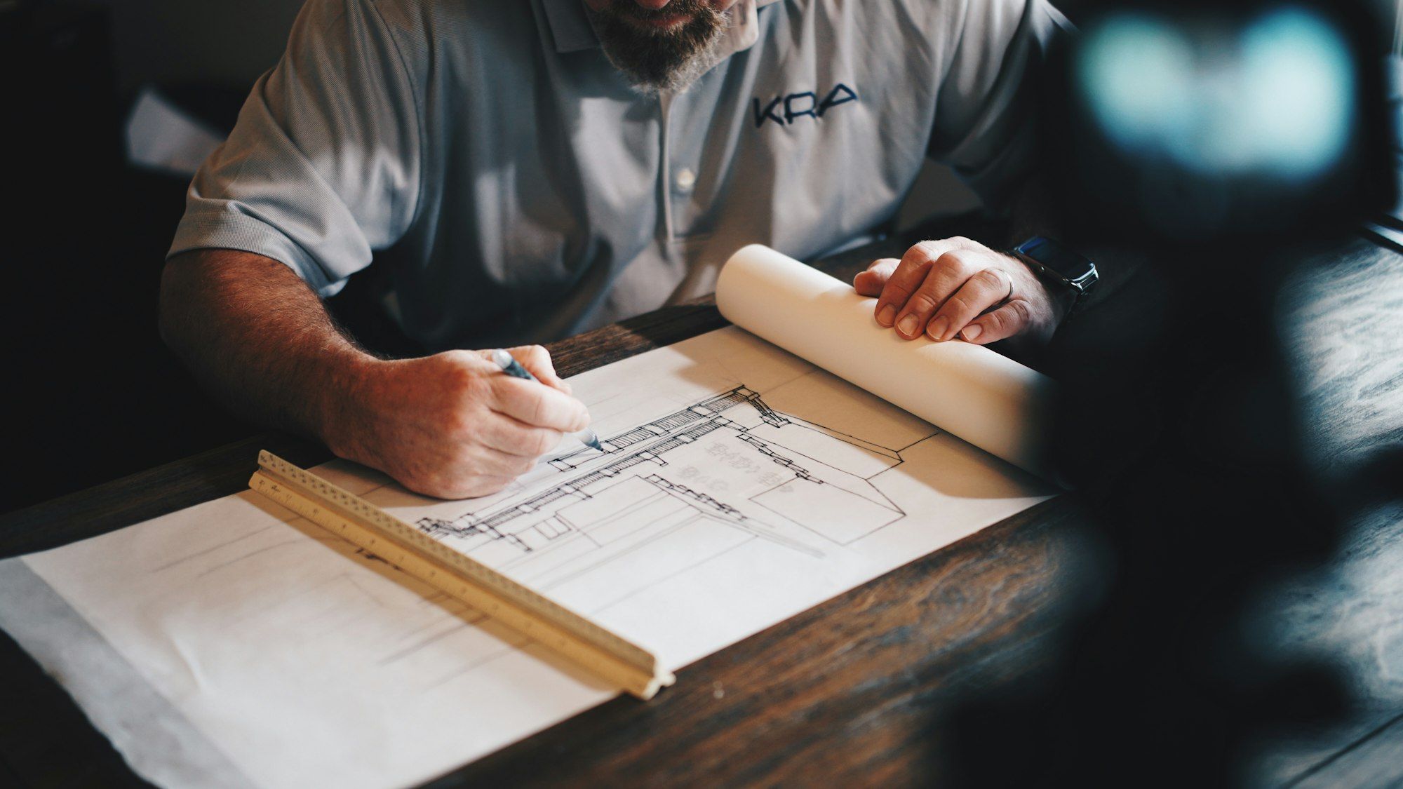 Blue Sky Services contractor reviewing building plans in Raleigh North Carolina